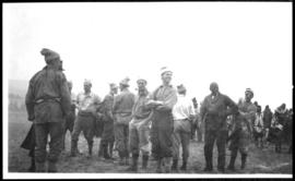 Casual portrait of men standing in a field
