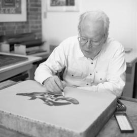 [Bill Reid drawing on lithographic stone]