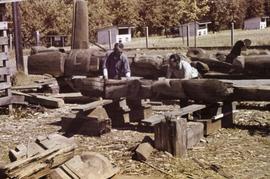 Mungo Martin and Charles Docherty working on a totem pole