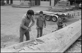 Crew working on log at the Turnbull & Gail construction yard in Richmond (contractors for bui...