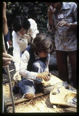 Children learning to carve